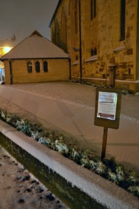 The new hall and a musical event notice, in the snow The new hall and a musical event notice, in the snow